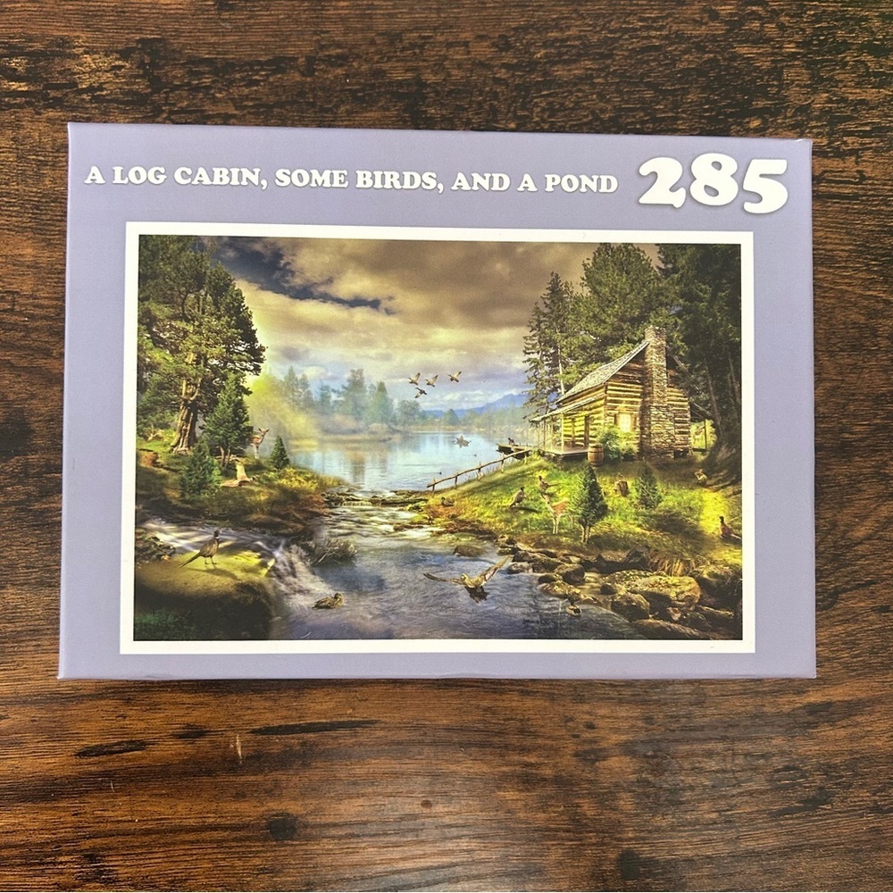 White Elephant Gag Gift Log Cabin Puzzle with Birds and Pond Funny Joke Meme